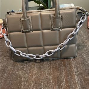 Taupe color with a chain link strap